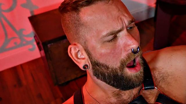 Hairy jock in leather and boots assfisted by BF