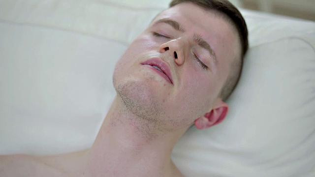 Pierced stud masturbating solo on couch before cumming