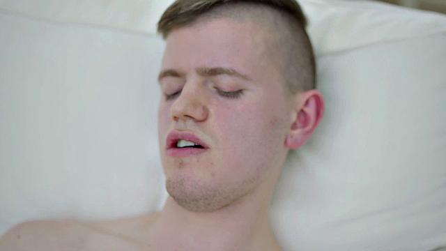 Pierced stud masturbating solo on couch before cumming