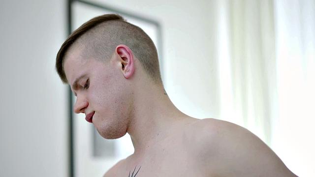 Pierced stud masturbating solo on couch before cumming