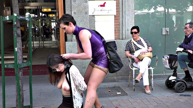 Busty slut submits publicly in front of crowding voyeurs