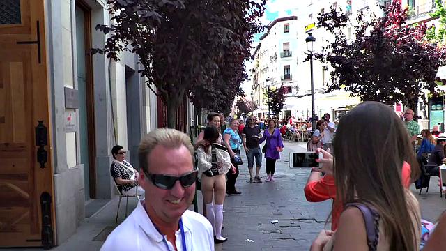 Busty slut submits publicly in front of crowding voyeurs