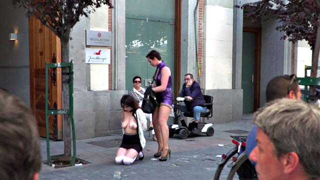 Busty slut submits publicly in front of crowding voyeurs