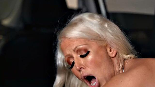 Bisexual busty MILF in threesome at car dealership