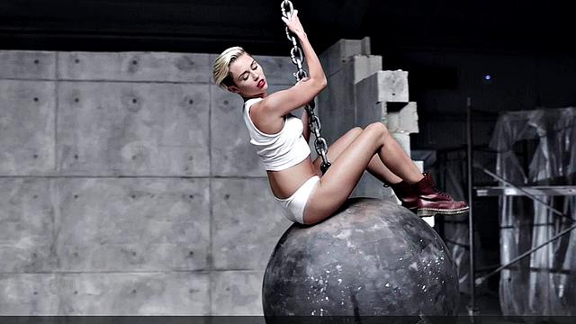 Miley Cyrus completely naked on the ball