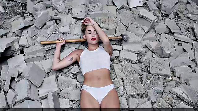 Miley Cyrus completely naked on the ball