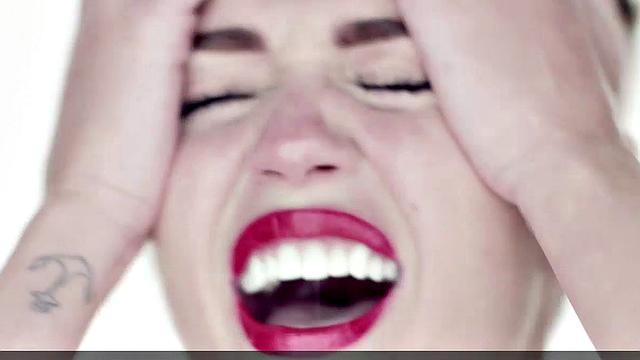 Miley Cyrus completely naked on the ball