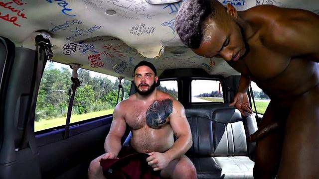 Muscled jock fucks black ass in public outdoor van
