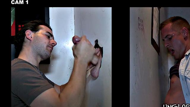 Gay stud sucks and strokes guy's cock in gloryhole