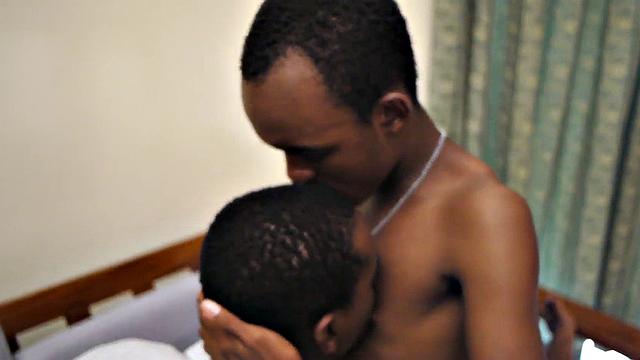 Ebony twink jerks uncut cock while barebacked