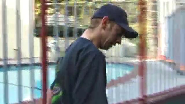 Pax skates in jeans, boxers, visor, and a black Bruce Lee t-shirt. Back on his bed, he loses all, looking more inviting when we see his blonde hair, tattoos, and stiff cock.