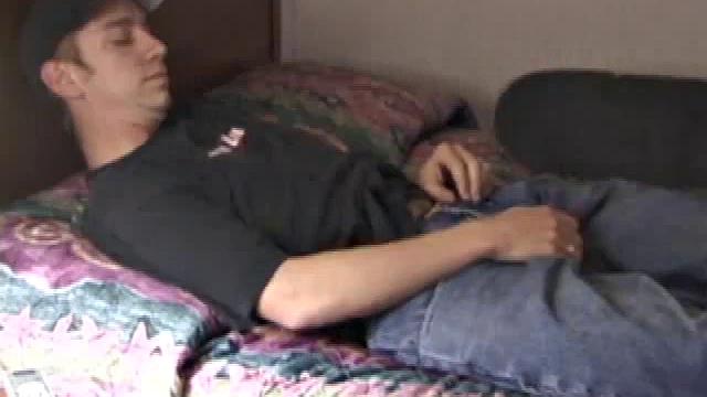 Pax skates in jeans, boxers, visor, and a black Bruce Lee t-shirt. Back on his bed, he loses all, looking more inviting when we see his blonde hair, tattoos, and stiff cock.