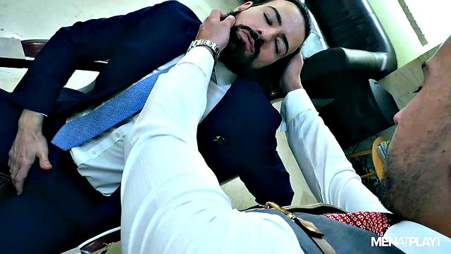 Two men hook up for sex in the barbershop chair