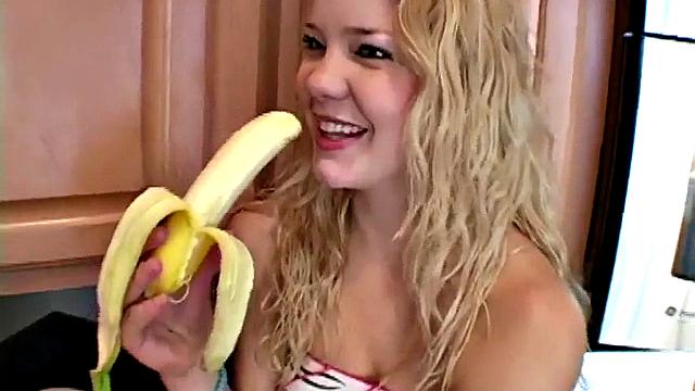 Naughty solo teen chewing on a banana
