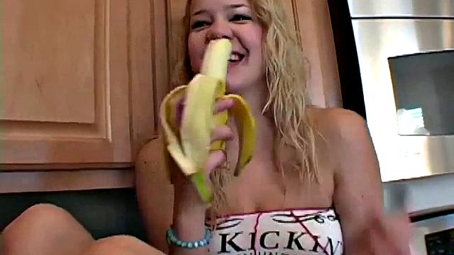 Naughty solo teen chewing on a banana