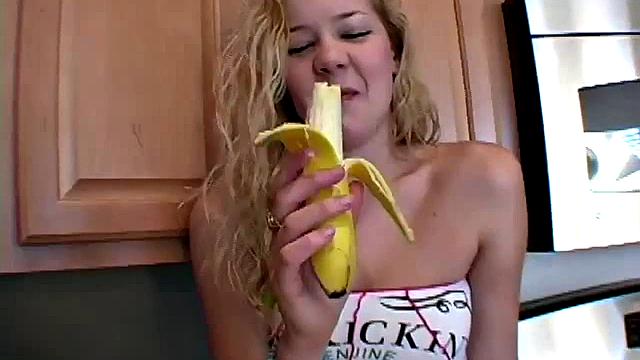Naughty solo teen chewing on a banana