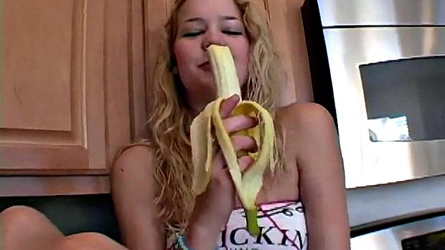Naughty solo teen chewing on a banana