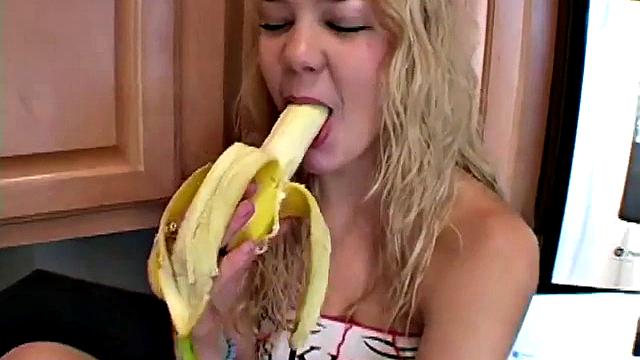 Naughty solo teen chewing on a banana