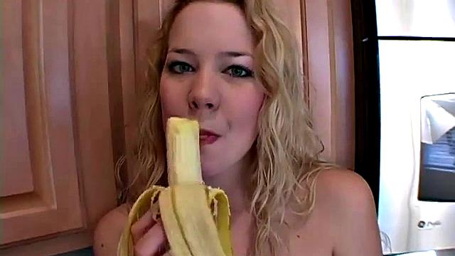 Naughty solo teen chewing on a banana