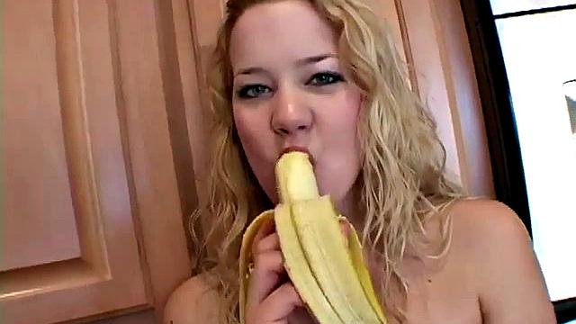 Naughty solo teen chewing on a banana