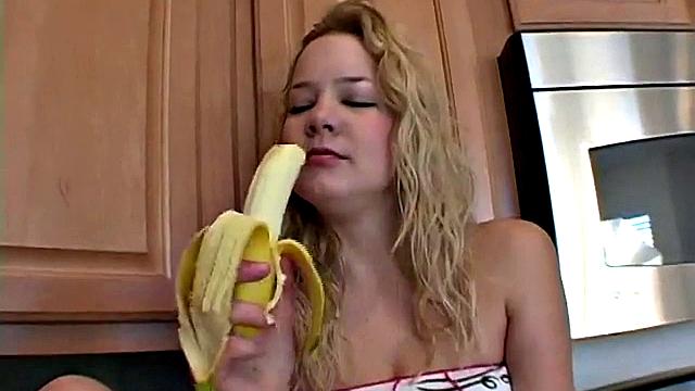 Naughty solo teen chewing on a banana