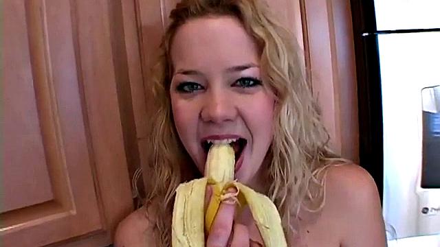 Naughty solo teen chewing on a banana