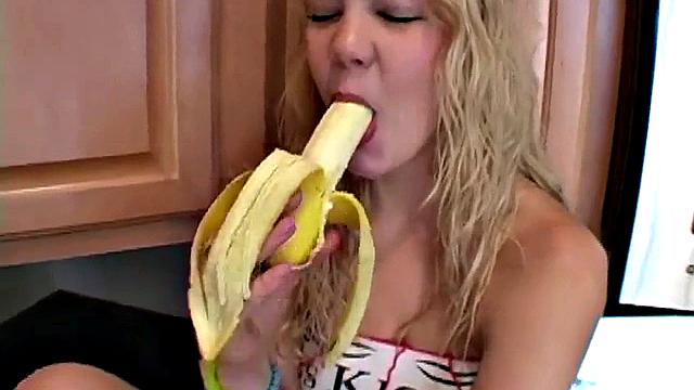 Naughty solo teen chewing on a banana