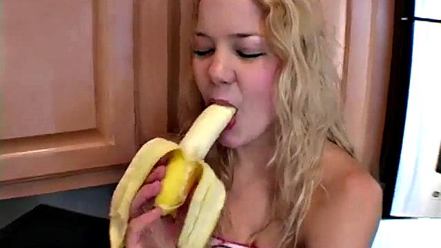 Naughty solo teen chewing on a banana