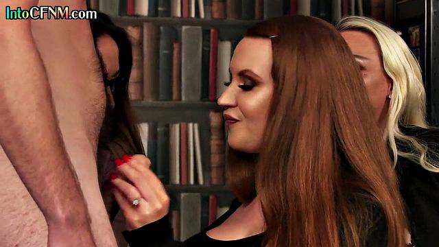 Classy CFNM babes give BJ in library