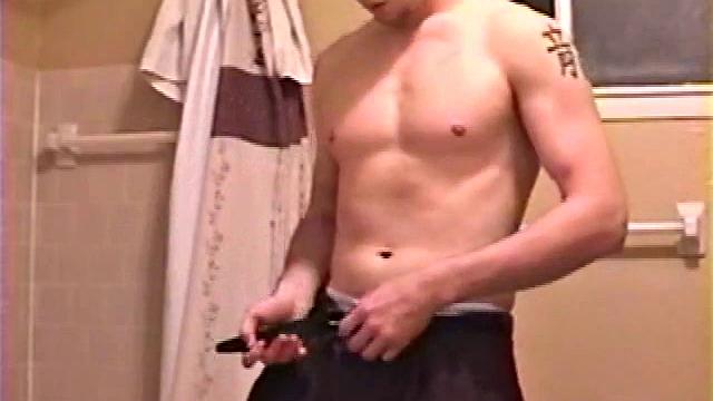 After a busy day Shawn is in the bathroom getting ready to shower and decides to play with himself through his pants. He strips and flexes for the camera, while stroking his hard cock, and soon Shawn blasts a warm cum load onto his chest.