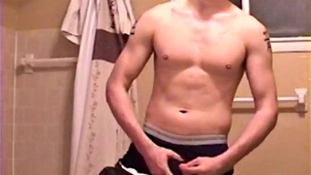 After a busy day Shawn is in the bathroom getting ready to shower and decides to play with himself through his pants. He strips and flexes for the camera, while stroking his hard cock, and soon Shawn blasts a warm cum load onto his chest.