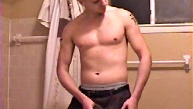 After a busy day Shawn is in the bathroom getting ready to shower and decides to play with himself through his pants. He strips and flexes for the camera, while stroking his hard cock, and soon Shawn blasts a warm cum load onto his chest.