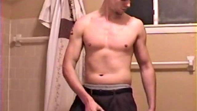 After a busy day Shawn is in the bathroom getting ready to shower and decides to play with himself through his pants. He strips and flexes for the camera, while stroking his hard cock, and soon Shawn blasts a warm cum load onto his chest.