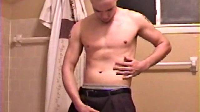 After a busy day Shawn is in the bathroom getting ready to shower and decides to play with himself through his pants. He strips and flexes for the camera, while stroking his hard cock, and soon Shawn blasts a warm cum load onto his chest.