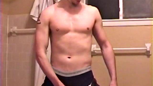 After a busy day Shawn is in the bathroom getting ready to shower and decides to play with himself through his pants. He strips and flexes for the camera, while stroking his hard cock, and soon Shawn blasts a warm cum load onto his chest.