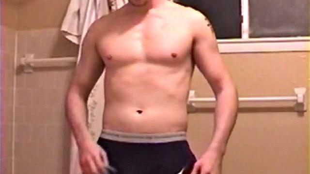 After a busy day Shawn is in the bathroom getting ready to shower and decides to play with himself through his pants. He strips and flexes for the camera, while stroking his hard cock, and soon Shawn blasts a warm cum load onto his chest.