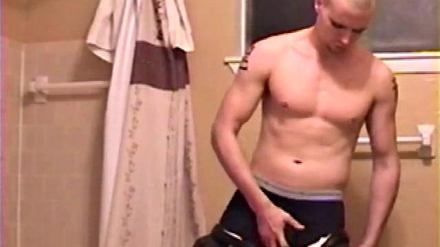 After a busy day Shawn is in the bathroom getting ready to shower and decides to play with himself through his pants. He strips and flexes for the camera, while stroking his hard cock, and soon Shawn blasts a warm cum load onto his chest.