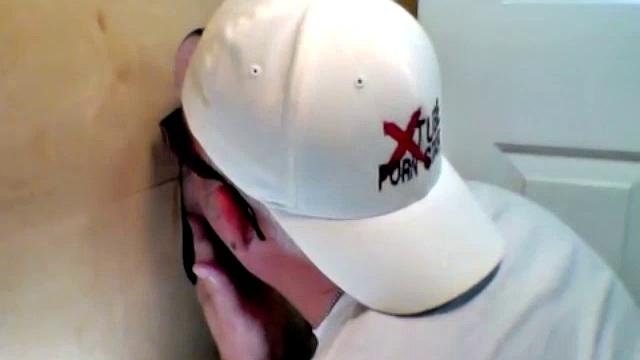 anonymous blowjob at the gloryhole in a gay booth