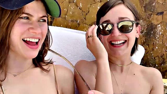 Alexandra Daddario flaunts her bikini body in the pool and shows off her smile