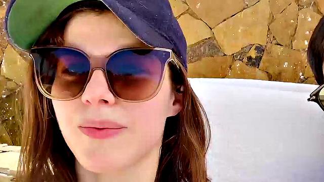 Alexandra Daddario flaunts her bikini body in the pool and shows off her smile