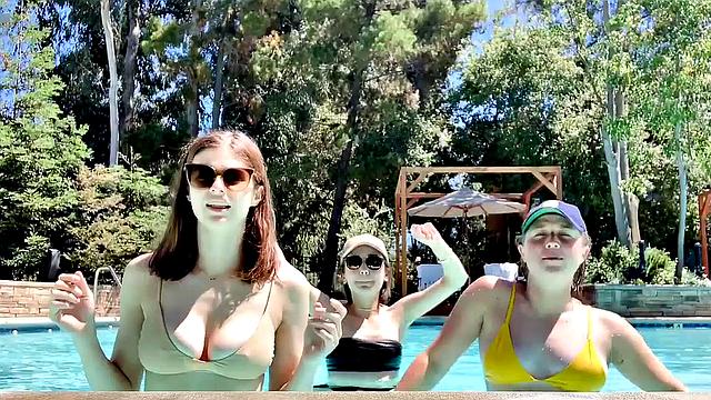 Alexandra Daddario flaunts her bikini body in the pool and shows off her smile