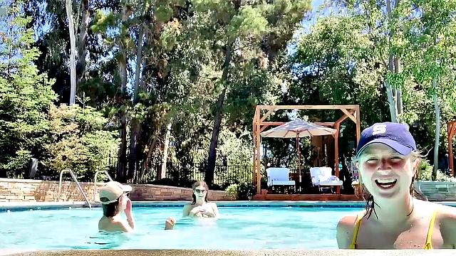 Alexandra Daddario flaunts her bikini body in the pool and shows off her smile