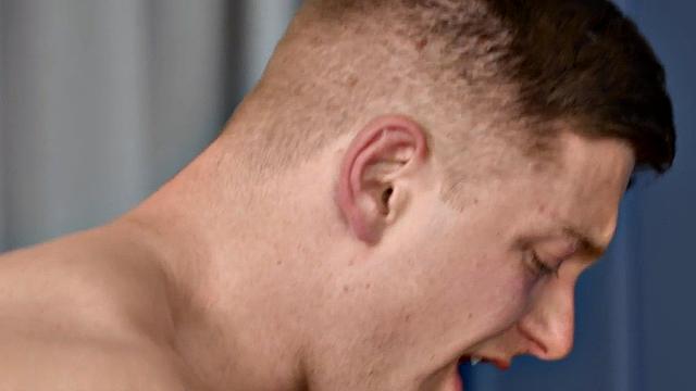 Muscular jock pounding stud on sofa after deepthroating