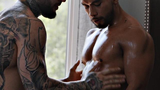 Inked muscled stud barebacks Latino lover in the bed