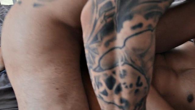 Inked muscled stud barebacks Latino lover in the bed