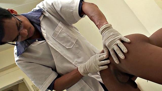 Assfingered Asian twink pissing before by doctor