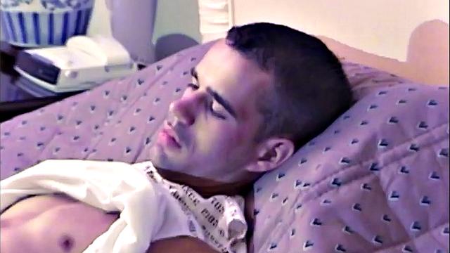 Zac is a toned young man, who is stretched out on the bed and working up a boner. Once naked and hard, he's up on his knees, stroking that cock.