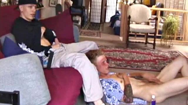 Brandon sits on the floor and rubs the growing bulge in his pants while he watches some bimbos on the TV. Shane comes up the stairs and notices that Brandon is already hard at work and sits down on the couch behind him.