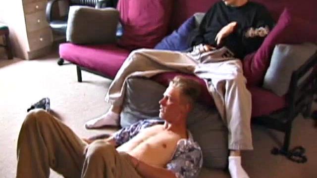 Brandon sits on the floor and rubs the growing bulge in his pants while he watches some bimbos on the TV. Shane comes up the stairs and notices that Brandon is already hard at work and sits down on the couch behind him.