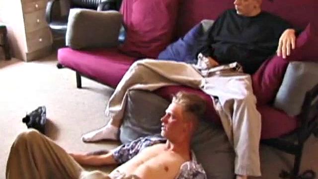 Brandon sits on the floor and rubs the growing bulge in his pants while he watches some bimbos on the TV. Shane comes up the stairs and notices that Brandon is already hard at work and sits down on the couch behind him.